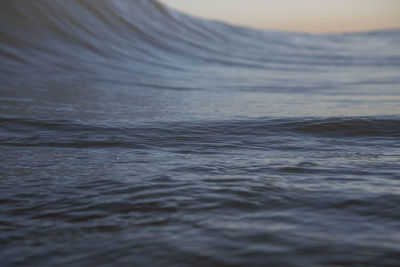 Waves in sea during sunset