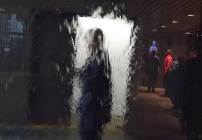 Blurred motion of woman at night