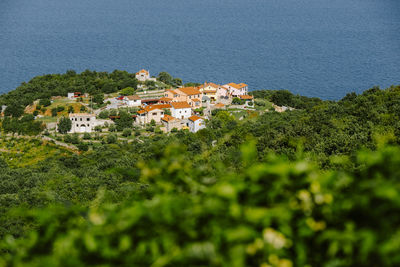 High angle view of townscape by sea