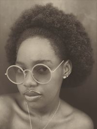 Close-up portrait of young woman with curly hair