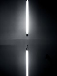 Illuminated light by mirror in room