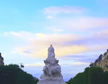Low angle view of statue against sky