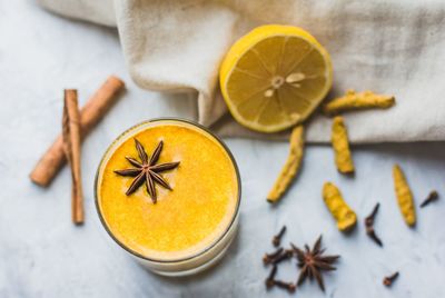 Healthy ayurvedic drink with golden almond milk or turmeric latte. trendy asian natural detox drink