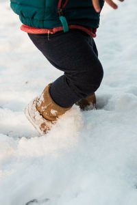 Low section of child against sky