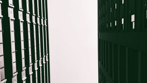 Close-up of metal fence against building