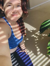 Portrait of smiling young woman standing outdoors