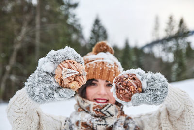 Winter portrait of a young woman. winter clothes, snow.