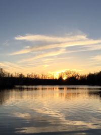 Scenic view of lake against sky during sunset