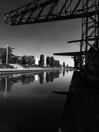Low angle view of bridge over river against sky