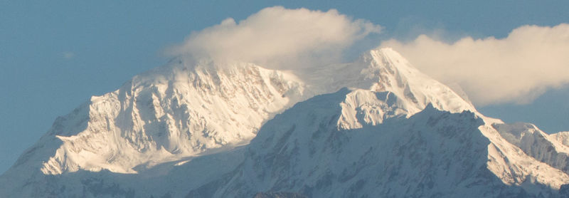 Panoramic view of snowcapped mountains against sky