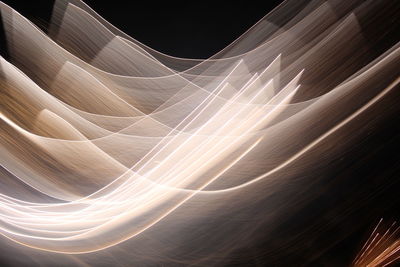 Full frame shot of illuminated light trails at night