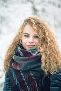 Portrait of smiling woman in snow