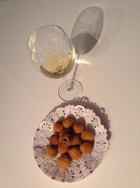 High angle view of wine in glass on table