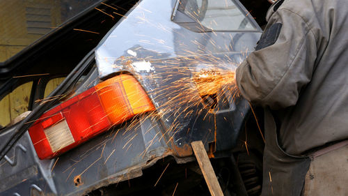 Mechanic repairing car