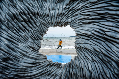 Reflection of people on sea