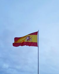 Low angle view of flag against sky