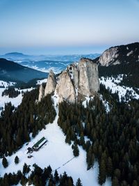 Scenic view of snow covered mountains against sky