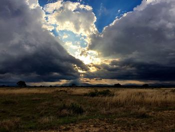 Scenic view of landscape against cloudy sky