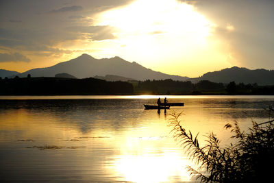 Scenic view of sunset over lake