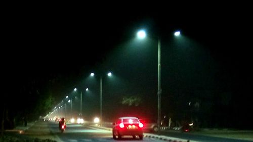 Cars on road at night