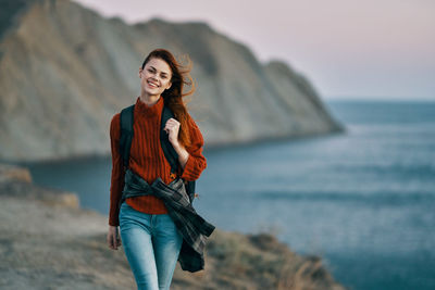 Portrait of smiling young woman on beach