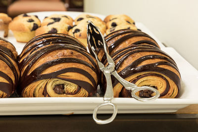 Flakey chocolate croissant grouped on a plate in a bakery fresh from the oven