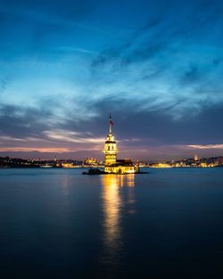 View of illuminated city at sunset