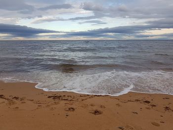 Scenic view of beach against sky