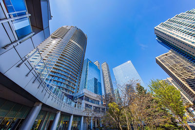 Low angle view of modern buildings against sky