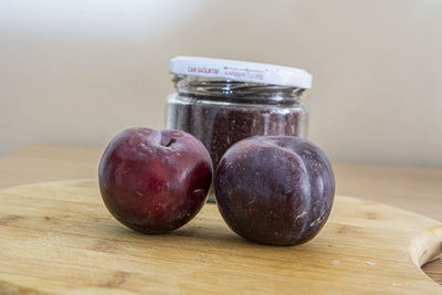 Close-up of apples in jar on table