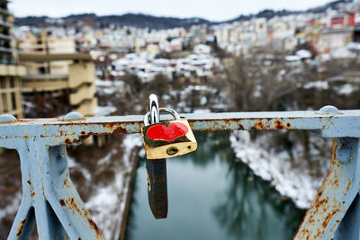 Close-up of padlocks on railing