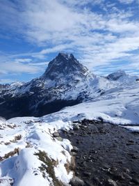 Scenic view of snowcapped mountains against sky