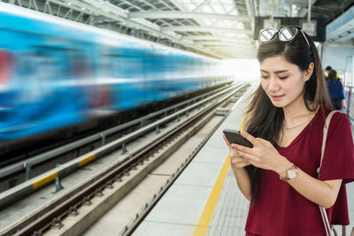 Young woman using mobile phone