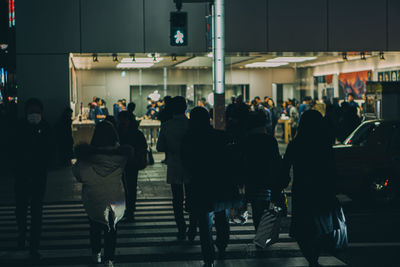 People walking on street in city