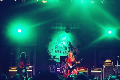 Woman playing music at concert