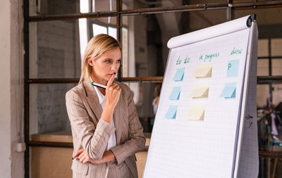 Portrait of young businesswoman working at office