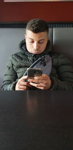 Young man using mobile phone