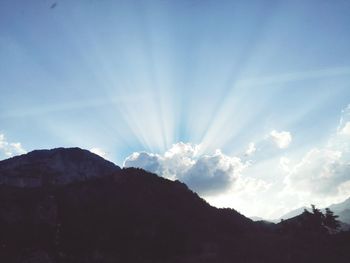 Scenic view of silhouette mountains against sky