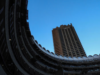 Low angle view of buildings against clear blue sky