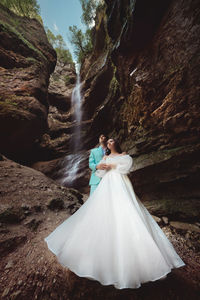 Wedding of a beautiful couple, the bride is dressed in a white dress. stylish shooting against the