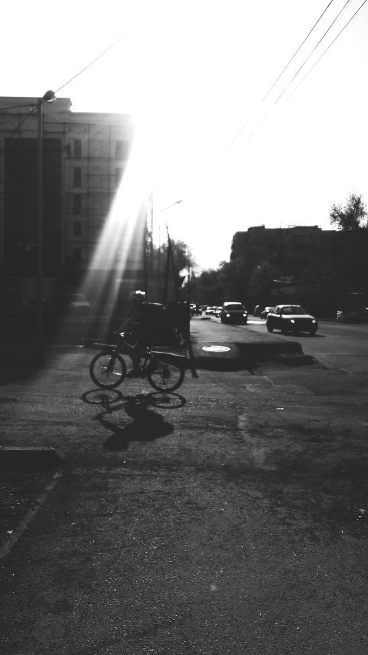 CARS IN CITY AGAINST CLEAR SKY