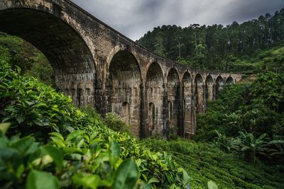 Arch bridge against sky