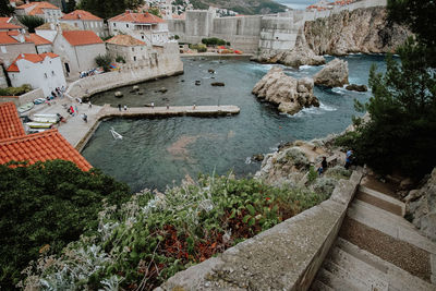 High angle view of town by sea