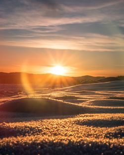 Scenic view of landscape against sky during sunset