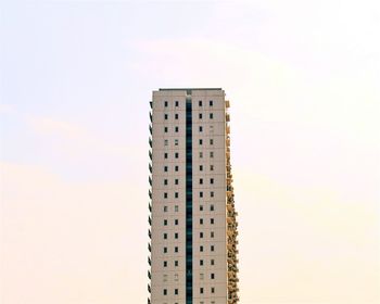 Low angle view of building against sky at sunset