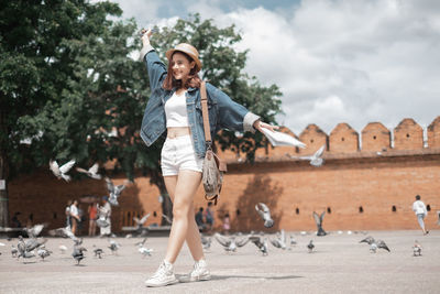 Full length portrait of young woman