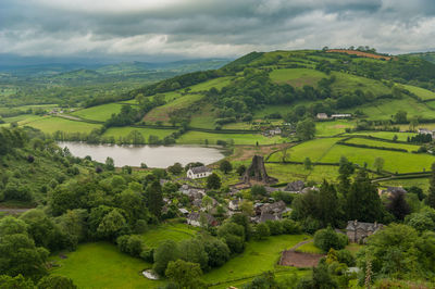 Scenic view of green landscape against sky