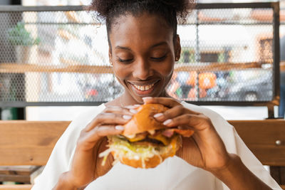 Midsection of woman eating food