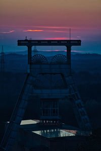 Vertical shot of a headframe tower after sunset at halde hoheward in herten, germany