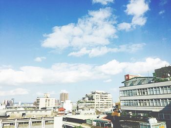 View of buildings against cloudy sky